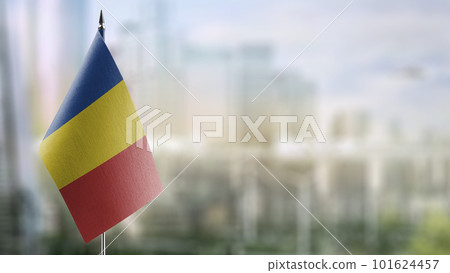 Small flags of the Romania on an abstract blurry background Small flags of the Romania on an abstract blurry background 101624457