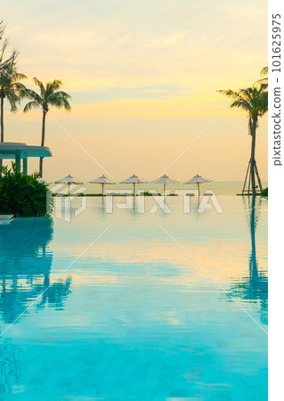 umbrella with bed pool around swimming pool with ocean sea background 101625975