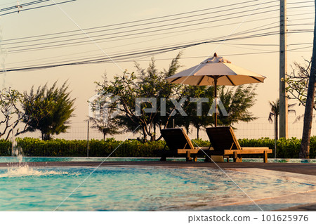 umbrella with bed pool around swimming pool with ocean sea background umbrella with bed pool around swimming pool with ocean sea background 101625976