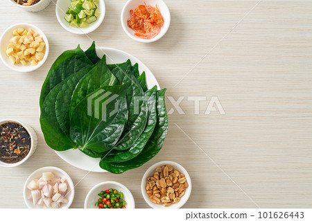 Miang kham - A royal leaf wrap appetizer Miang kham - A royal leaf wrap appetizer 101626443