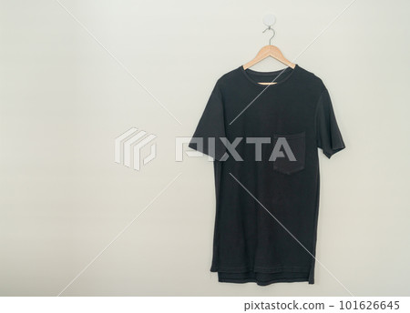 t-shirt hanging with wood hanger 101626645