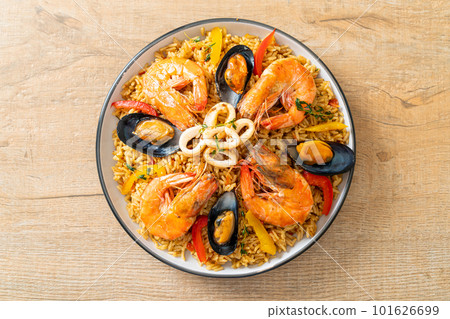 Seafood Paella with prawns, clams, mussels on saffron rice Seafood Paella with prawns, clams, mussels on saffron rice 101626699