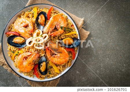 Seafood Paella with prawns, clams, mussels on saffron rice Seafood Paella with prawns, clams, mussels on saffron rice 101626701