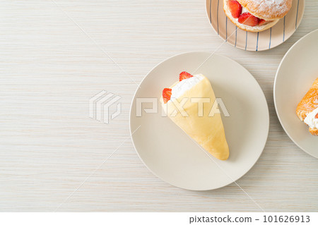 fresh strawberry cream crepe on plate 101626913