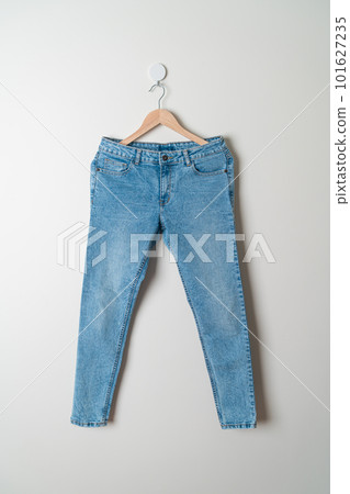 jeans trousers hanging on wall 101627235
