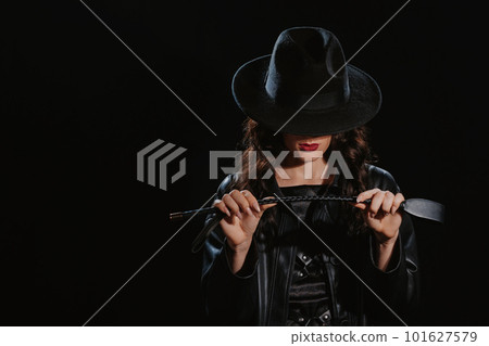 Sexy female dominant mistress with a whip flogger for punishment for BDSM sex with submission and domination 101627579