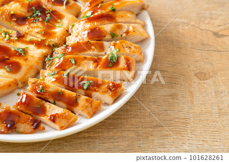 grilled chicken breast sliced on plate 101628261