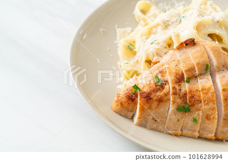 fettucine pasta white creamy sauce with grilled chicken fettucine pasta white creamy sauce with grilled chicken 101628994