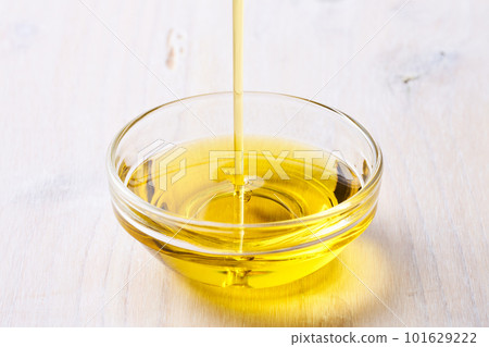 Olive oil poured into a glass dish Olive oil poured into a glass dish 101629222