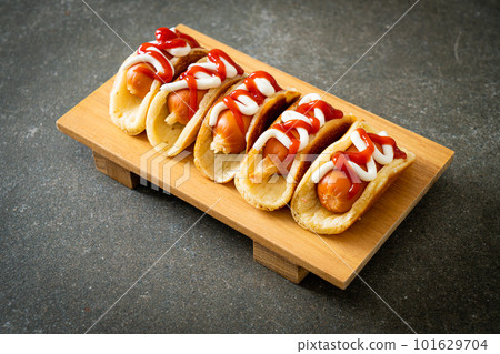 flat pancake roll with sausage 101629704