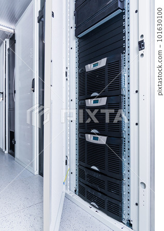 Data center with a row of server racks Data center with a row of server racks 101630100