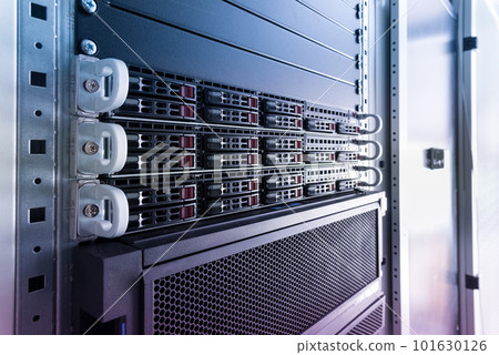 Row of hard drives serving as data storage inside server room 101630126