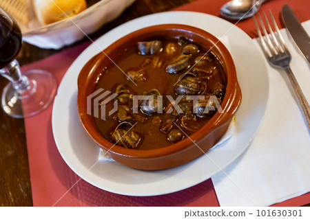 Mediterranean seafood stew of caracoles snails with vegetable sauce Mediterranean seafood stew of caracoles snails with vegetable sauce 101630301