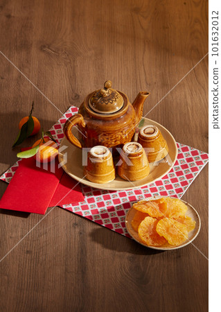 Top view of traditional food and tea. Photography Tet holiday content. Tet holiday decoration concept Top view of traditional food and tea. Photography Tet holiday content. Tet holiday decoration concept 101632012