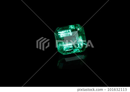 Macro mineral Emerald gemstone faceted on black background Macro mineral Emerald gemstone faceted on black background 101632113