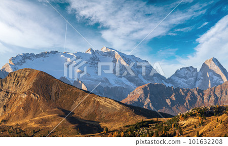 Autumn alpine Dolomites mountain scene, Sudtirol, Italy. View from Falzarego Pass to Marmolada massif and Glacier. 101632208