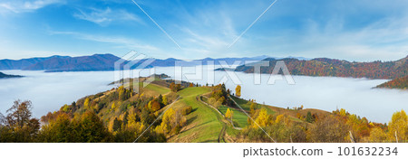 Morning foggy clouds in autumn mountain countryside.  Ukraine, Carpathian Mountains, Transcarpathia. Peaceful picturesque traveling, seasonal, nature and countryside beauty concept scene. 101632234