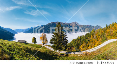 Peaceful misty autumn morning mountain view from hiking path from Dorfgastein to Paarseen lakes, Land Salzburg, Austria. 101633095