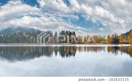 Mountain alpine autumn lake Schwarzsee, Kitzbuhel, Tirol, Austria Alps. 101633135