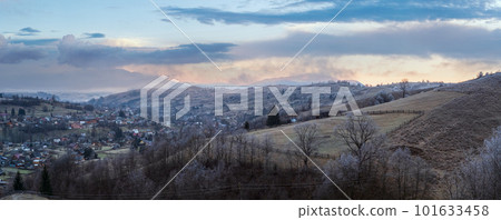 Winter coming. Last good weather days in autumn mountains countryside morning peaceful picturesque scene. Dirty road from hills to the village. Winter coming. Last good weather days in autumn mountains countryside morning peaceful picturesque scene. Dirty road from hills to the village. 101633458
