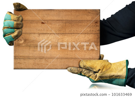 Carpenter with Work Gloves Holding a Brown Wooden Plank Carpenter with Work Gloves Holding a Brown Wooden Plank 101633469