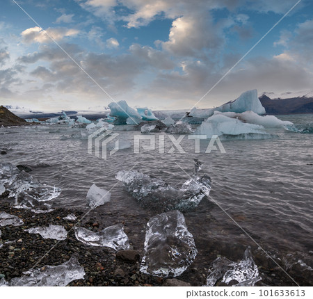 Jokulsarlon glacial lake, lagoon with ice blocks, Iceland. Situated near the edge of the Atlantic Ocean at the head of the Breidamerkurjokull glacier, Vatnajokull icecap or Vatna Glacier. Jokulsarlon glacial lake, lagoon with ice blocks, Iceland. Situated near the edge of the Atlantic Ocean at the head of the Breidamerkurjokull glacier, Vatnajokull icecap or Vatna Glacier. 101633613