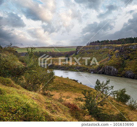 Hrutey island public park near Blonduos town, North-West of Iceland. View during auto trip by Ring Road. Spectacular Icelandic landscape with scenic autumn nature and Blanda river with cataracts. 101633690