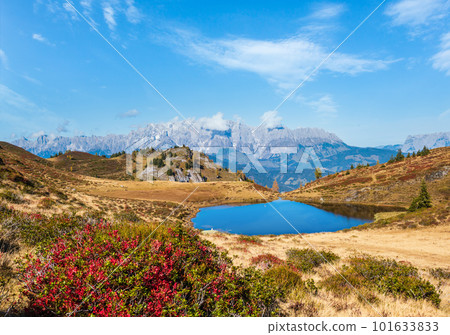 Autumn alpine Kleiner Paarsee or Paarseen lake, Land Salzburg, Austria. Alps Hochkonig rocky mountain group view in far. Autumn alpine Kleiner Paarsee or Paarseen lake, Land Salzburg, Austria. Alps Hochkonig rocky mountain group view in far. 101633833