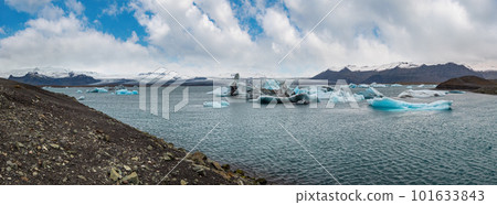 Jokulsarlon glacial lake, lagoon with ice blocks, Iceland. Situated near the edge of the Atlantic Ocean at the head of the Breidamerkurjokull glacier, Vatnajokull icecap or Vatna Glacier. Jokulsarlon glacial lake, lagoon with ice blocks, Iceland. Situated near the edge of the Atlantic Ocean at the head of the Breidamerkurjokull glacier, Vatnajokull icecap or Vatna Glacier. 101633843