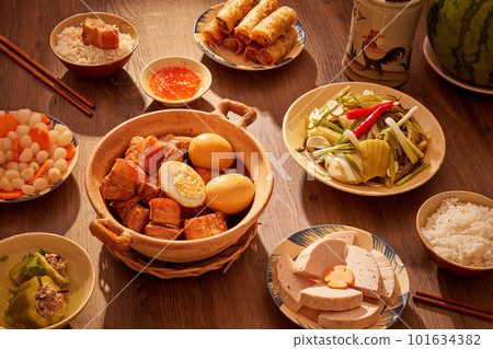 A classic Vietnamese dish with caramelized pork and eggs as the main dish and other foods. Tet holiday concept A classic Vietnamese dish with caramelized pork and eggs as the main dish and other foods. Tet holiday concept 101634382