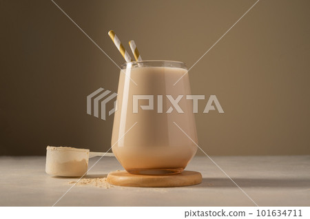 Healthy chocolate protein shake drink with straw, and protein powder 101634711
