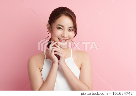 Beautiful young asian woman with clean fresh skin on pink background, Face care, Facial treatment, Cosmetology, beauty and spa, Asian women portrait. Beautiful young asian woman with clean fresh skin on pink background, Face care, Facial treatment, Cosmetology, beauty and spa, Asian women portrait. 101634742