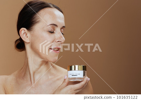 Portrait of modern female isolated on beige background 101635122