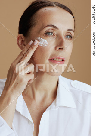 modern woman in white shirt on beige background modern woman in white shirt on beige background 101635146