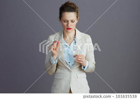 stressed 40 years old woman employee in light business suit 101635539