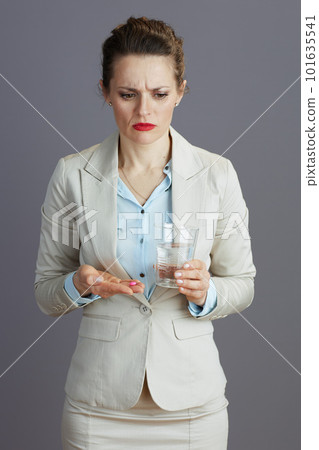 tired elegant woman worker in light business suit tired elegant woman worker in light business suit 101635541