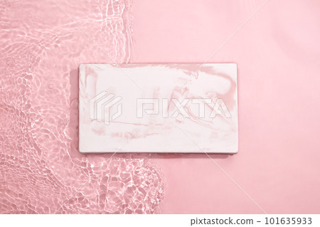 Cosmetic and beauty product branding design can be displayed on marble rectangle platform. Light pink background with water Cosmetic and beauty product branding design can be displayed on marble rectangle platform. Light pink background with water 101635933