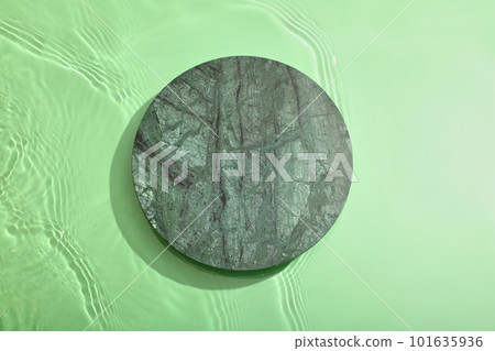 Empty stone circle podium on transparent clear green water texture with splashes and waves. Flat lay Empty stone circle podium on transparent clear green water texture with splashes and waves. Flat lay 101635936
