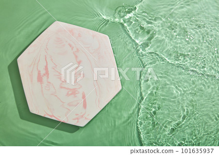 Hexagon podium on transparent clear green water texture with splashes and waves in sunlight. View from above Hexagon podium on transparent clear green water texture with splashes and waves in sunlight. View from above 101635937