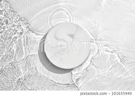 White circle podium on transparent clear water texture with splashes and waves in sunlight. Blank space for product promotion White circle podium on transparent clear water texture with splashes and waves in sunlight. Blank space for product promotion 101635940