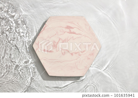 Empty marble podium on transparent clear white calm water texture with splashes and waves in sunlight for product advertising Empty marble podium on transparent clear white calm water texture with splashes and waves in sunlight for product advertising 101635941