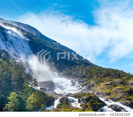 Summer mountain Langfossen waterfall on slope (Etne, Norway). Summer mountain Langfossen waterfall on slope (Etne, Norway). 101636169