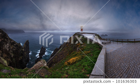 Glows Cape Ortegal Lighthouse (Province of A Coruna, Galicia, Spain). Summer rainy late evening view. Glows Cape Ortegal Lighthouse (Province of A Coruna, Galicia, Spain). Summer rainy late evening view. 101636303