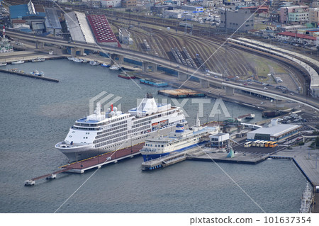 The scenery of the berthing work of the cruise ship Silver Whisper calling at Hakodate Port in Hakodate City, Hokkaido in spring, taken from Mt. Hakodate The scenery of the berthing work of the cruise ship Silver Whisper calling at Hakodate Port in Hakodate City, Hokkaido in spring, taken from Mt. Hakodate 101637354