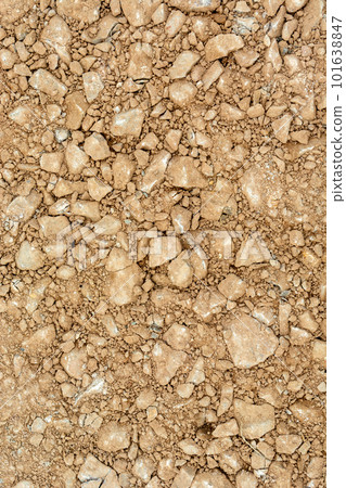 Red earth with stones, top view Red earth with stones, top view 101638847