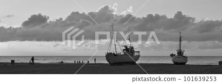 Beach scene at Slettestrand. Fishing boats on the shore. 101639253