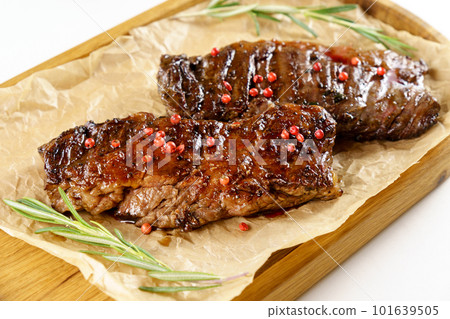 Aged barbecue beef steak close up on wooden background. banner, menu. 101639505