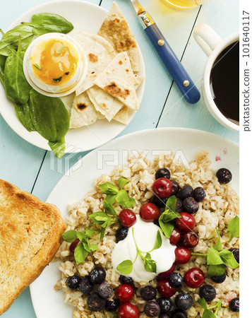 Morning porridge with berries Morning porridge with berries 101640117
