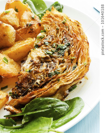 Baked potatoes with cabbage Baked potatoes with cabbage 101640188