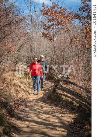 Senior couple hiking 101641411